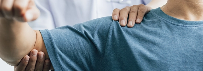 A person receiving an arm exam.